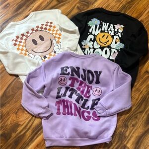 SHEIN Kids Smiley Graphic Sweatshirt Trio - White, Black, and Purple